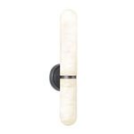 Salon Sconce lit with soft warm glow from alabaster globes highlighting stone veins