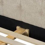 Interior view of headboard frame showing wooden slats and support structure underneath fabric