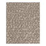 Macro close-up showing detailed texture of beige bouclé upholstery fabric