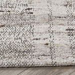 Close-up of soft wool weave showing hand-carded loops and mixed neutral tones