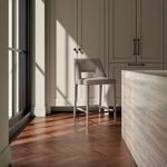 Joyce counter stool styled in sunlit breakfast nook with wood floor and cream cabinetry