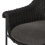 Close-up of woven black wicker surface with tight square weave pattern