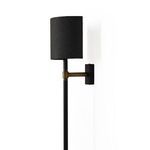 Maurice Sconce from back showing curved shade open interior and black rectangular backplate