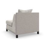 Back angle view showing textured woven fabric wrapping the back panel of the Tuxedo chair
