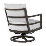 Swivel rocker chair angled rear with cushions revealing frame structure and circular base