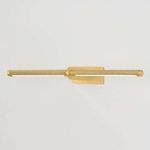 Top angled view highlighting knurled texture and brass finish on picture light