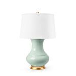 Front view of Thiri Lamp with white drum shade and gold finial against a white background
