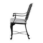 Side profile emphasizing curved armrest and thick white seat cushion