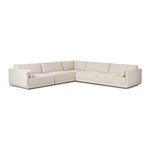 Front angle of Toland sectional corner highlighting loose and firm cushion backs in textured fabric