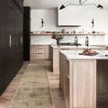 Runner version of rug placed in modern kitchen with wood cabinets and marble countertop