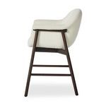 Profile side view highlighting thickness of cushioning and slight backward curve of backrest