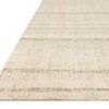 Close-up of rug corner on white background emphasizing flat edges and color variation