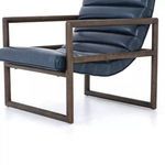 Closer side angle showing wood frame and cushioned seat detail of the chair