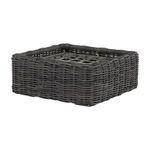 Woven ottoman base without cushion shown from side angle revealing lattice bottom
