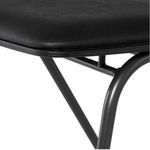 Close-up of the corner of the padded seat and round steel frame details