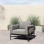 Hearst Outdoor Chair outdoor setting on concrete patio with desert plants in background