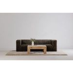 Front view of coffee table in minimalist room with black sofa and rug