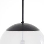 Close-up on the dark antiqued iron cap and top attachment of the Sutton Pendant