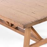 Close-up of Trellis Coffee Table showing the beveled edge, wood grain, and X-shaped base detail