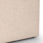 Close-up detail of chair base upholstery texture in natural beige fabric