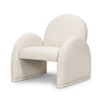 Cream upholstered accent chair with a rounded back and broad, curved armrests extending to the floor