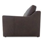 Side view highlighting the sloped right arm and clean seam detailing in dark espresso leather