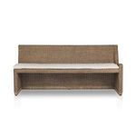 Senna Woven Dining Bench in natural rattan with soft curved frame and a beige fabric cushion