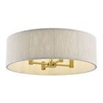 Side angle showing flush mount and detailed brass arms supporting the bulbs inside light shade