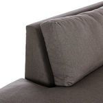 Close-up of loose back cushions and sturdy upholstered frame detail
