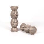 Pair of Kivu candle holders with one lying on its side revealing flat bottom and marble veining