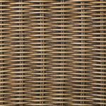 Close-up of beige tufted cushion corner on woven rattan armrest
