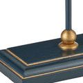 Close-up detail of navy-blue wooden lamp base corner with gold linear accents and brass ball detail