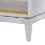 Close-up of tapered leg with grey wood grain and subtle distressing