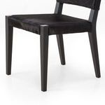 Close-up of Villa Dining Chair tapered front legs and upholstery detailing