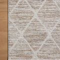 Corner close-up of Townes Pebble rug on wood floor showing subtle color shifts and neat binding