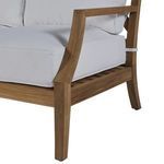 Close-up side angle showing armrest curve and cushion thickness