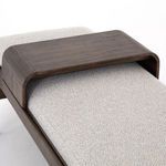 Close-up overhead view of solid dark walnut beechwood sliding tray over cushioned bench seat