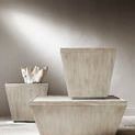 Two Landers end tables in room setting with soft wall lighting and decorative white coral on one table