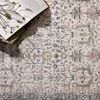 Close-up of rug with book, ceramic mug, and flower sprigs on top, emphasizing pattern clarity