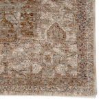 Close-up of soft texture and muted colors emphasizing the rug’s worn vintage appeal