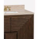 Close-up side angle showing detailed wood grain pattern and brass faucet on travertine countertop