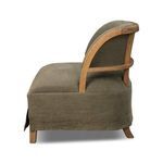 Side profile showing chair's curved exposed oak frame and rounded back cushion