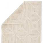 Natural fiber rug with ivory and beige tones featuring a hand woven diamond trellis pattern