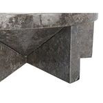 Close-up on the intersecting base pieces showing marble veining and sharp edges