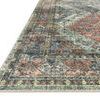 angled side view highlighting low pile texture and intricate pattern detail of the rug