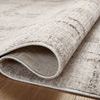 Rug folded to reveal the woven backing and flexible flatweave construction of the ivory plaid rug
