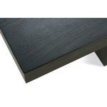 Detailed view of Mirage Cocktail Table’s smooth tabletop surface with visible charcoal oak grain
