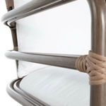 Side view of sofa's armrest showing curved oak poles and rattan detail