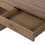 Close-up of Henry Desk side panel with visible natural wood knots and grain texture