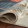 Close-up of the rug folded to show pile density and polypropylene weave texture